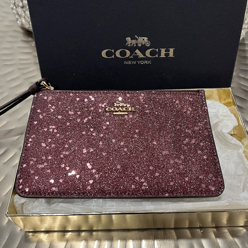 New Coach Wristlet in Beautiful Burgundy Star Glitter comes with gift box.